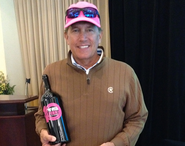 George Strait with 10th Anniversary Tough Enough bottle of Purple Cowboy Wine